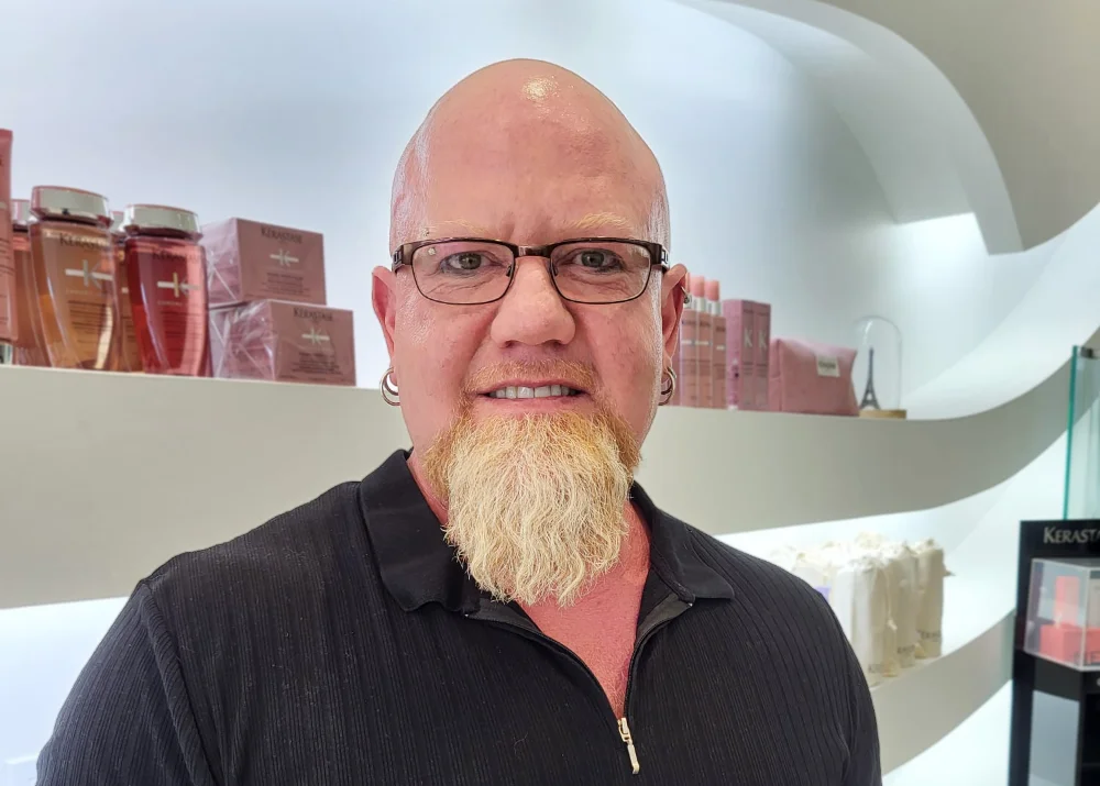 A portrait of Sebastien, a master stylist at Fresh & Co. Salons Mullen Way.
